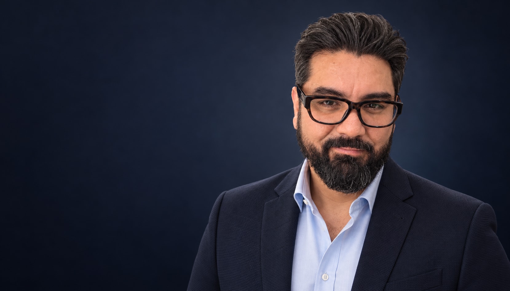 Ricardo Villaseñor in a navy blazer and light blue shirt